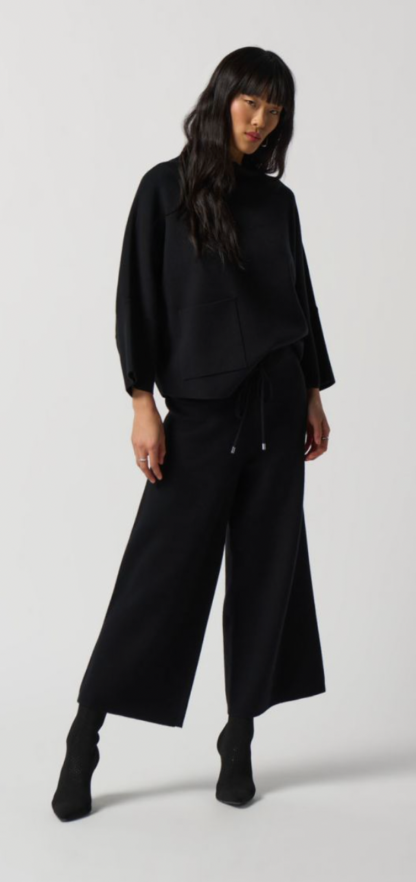black top and black pants with black shoes