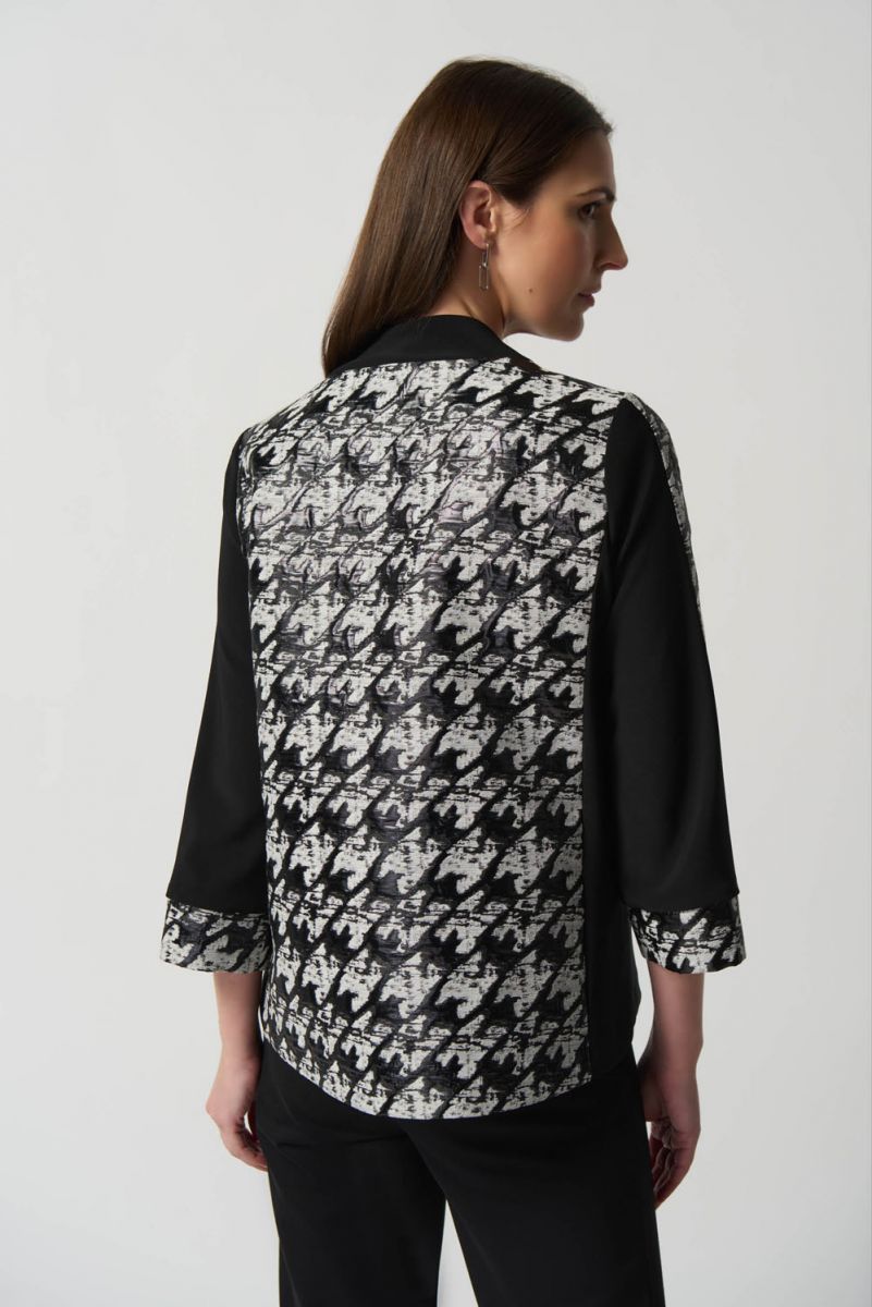 back of black and white with gray jacket 