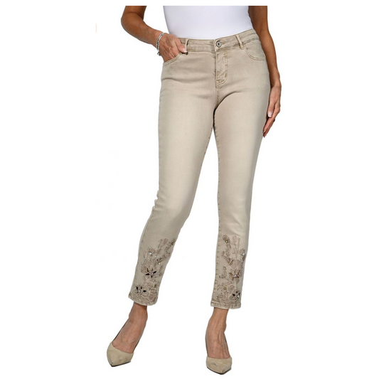 ivory denim jeans with embroidered pattern on bottoms of the pant legs